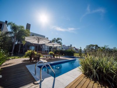 Casa em Condomínio à venda com 4 dormitórios, 375m² e 3 vagas no bairro Terra Ville, Zona Sul de Porto Alegre