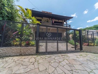 Casa à venda com 7 dormitórios, 950m² e 5 vagas no bairro Jardim Isabel, Zona Sul de Porto Alegre