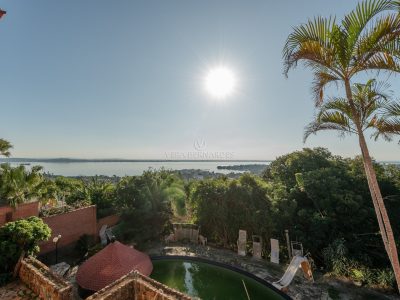 Casa à venda com 4 dormitórios, 1.000m² e 4 vagas no bairro Sétimo Céu, Zona Sul de Porto Alegre