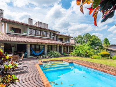 Casa em Condomínio à venda com 4 dormitórios, 523m² e 5 vagas no bairro Jardim do Sol, Zona Sul de Porto Alegre