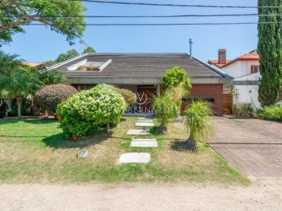 Casa em Condomínio à venda com 4 dormitórios, 435m² e 3 vagas no bairro Terra Ville, Zona Sul de Porto Alegre