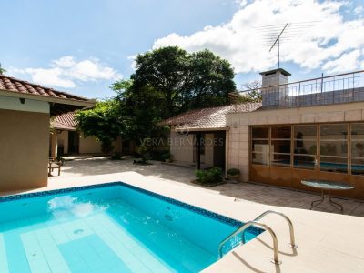 Casa à venda com 4 dormitórios, 337m² e 4 vagas no bairro Ipanema, Zona Sul de Porto Alegre
