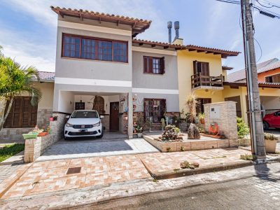 Casa em Condomínio à venda com 3 dormitórios, 166m² e 2 vagas no bairro Guarujá, Zona Sul de Porto Alegre