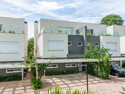 Casa em Condomínio à venda com 3 dormitórios, 456m² e 3 vagas no bairro Pedra Redonda, Zona Sul de Porto Alegre