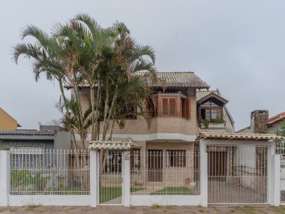 Casa à venda com 4 dormitórios, 160m² e 2 vagas no bairro Guarujá, Zona Sul de Porto Alegre