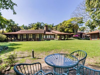 Casa em Condomínio à venda com 5 dormitórios, 1.179m² e 6 vagas no bairro Jardim do Sol, Zona Sul de Porto Alegre