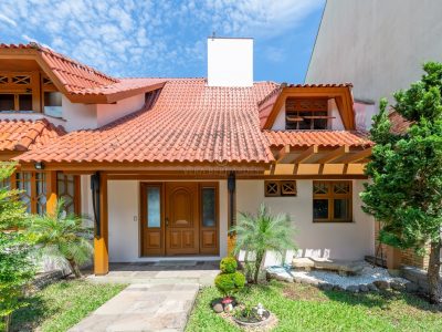 Casa à venda com 4 dormitórios, 411m² e 4 vagas no bairro Jardim Isabel, Zona Sul de Porto Alegre