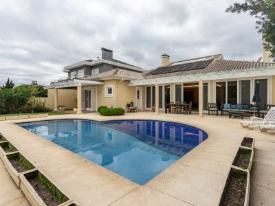 Casa em Condomínio à venda com 4 dormitórios, 410m² e 4 vagas no bairro Terra Ville, Zona Sul de Porto Alegre