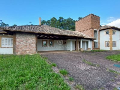 Casa em Condomínio à venda com 4 dormitórios, 600m² e 4 vagas no bairro Terra Ville, Zona Sul de Porto Alegre