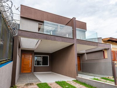 Casa à venda com 3 dormitórios, 125m² e 2 vagas no bairro Guarujá, Zona Sul de Porto Alegre