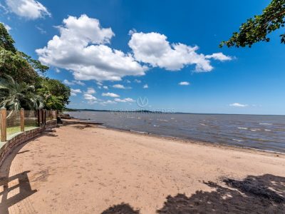 Casa Térrea à venda com 4 dormitórios, 482m² e 3 vagas no bairro Ponta Grossa, Zona Sul de Porto Alegre