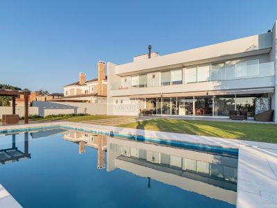 Casa em Condomínio à venda com 6 dormitórios, 711m² e 6 vagas no bairro Terra Ville, Zona Sul de Porto Alegre
