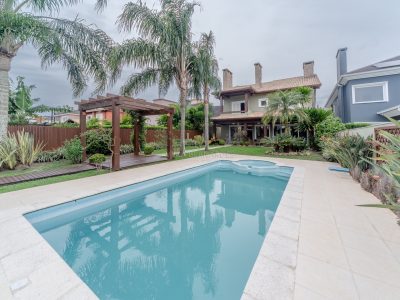 Casa em Condomínio à venda com 4 dormitórios, 386m² e 4 vagas no bairro Terra Ville, Zona Sul de Porto Alegre