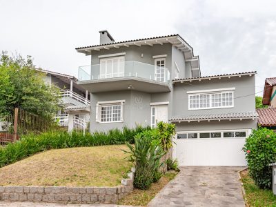 Casa em Condomínio à venda com 4 dormitórios, 290m² e 2 vagas no bairro Espírito Santo, Zona Sul de Porto Alegre
