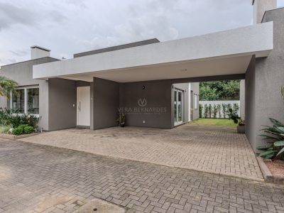 Casa em Condomínio à venda com 3 dormitórios, 168m² e 3 vagas no bairro Guarujá, Zona Sul de Porto Alegre
