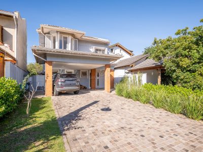 Casa em Condomínio à venda com 3 dormitórios, 216m² e 2 vagas no bairro Terra Ville, Zona Sul de Porto Alegre